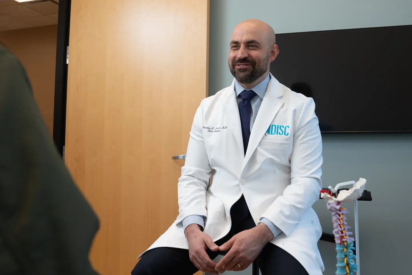 Dr. Hirsch speaking with a patient during a consultation