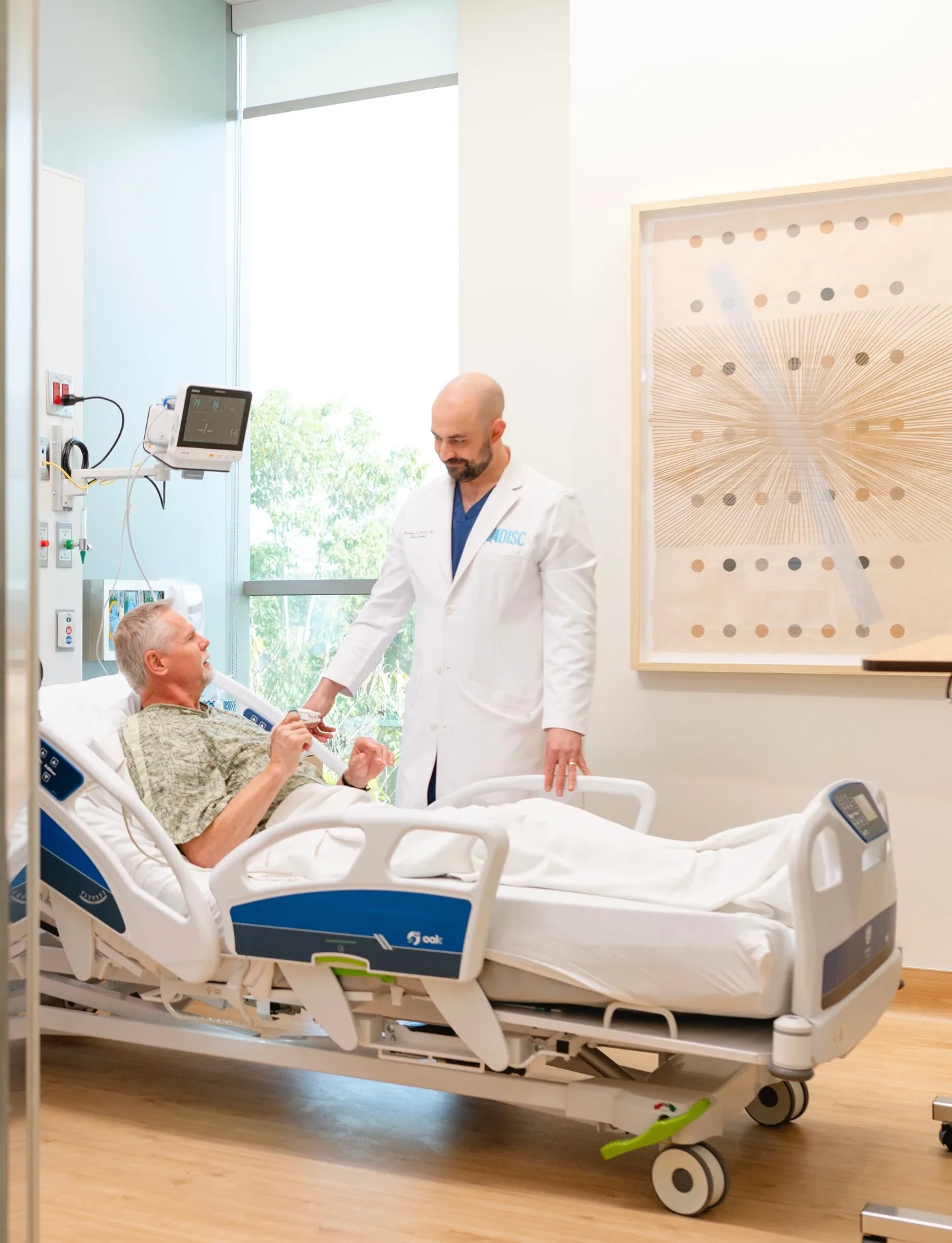 Dr. Hirsch with a patient at DISC Sports and Spine Center