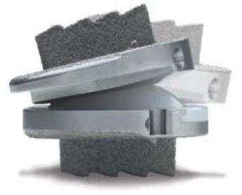 Lumbar artificial disc implant components separated to show the endplates and mobile bearing